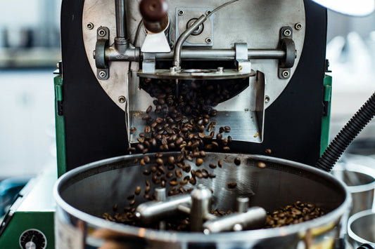 Freshly roasted organic coffee beans in a small batch roaster at UnitedBeans Coffee Roastery, offering 100% Arabica premium coffee beans