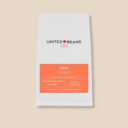 <img src="guji-ethiopia-coffee.png" alt="Guji Ethiopia medium-dark roast whole bean coffee label featuring flavor notes of apricot, grapefruit, and caramelized sugar">